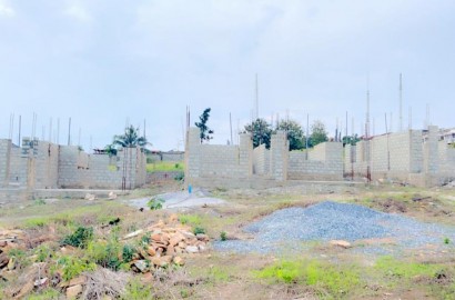 Eight (8) Plots of Land with 4-Bedroom Uncompleted House For Sale at Kwabenya