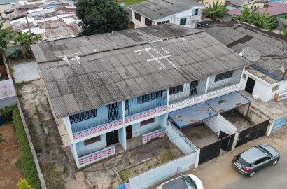 Prime Redevelopment Opportunity in Nima – Land with Existing Building for Sale