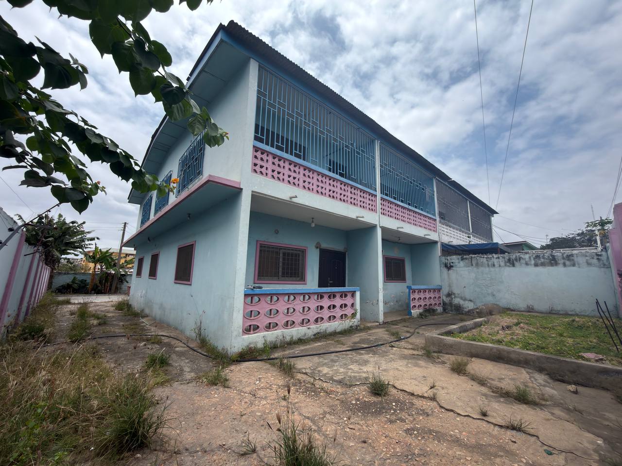 Prime Redevelopment Opportunity in Nima – Land with Existing Building for Sale