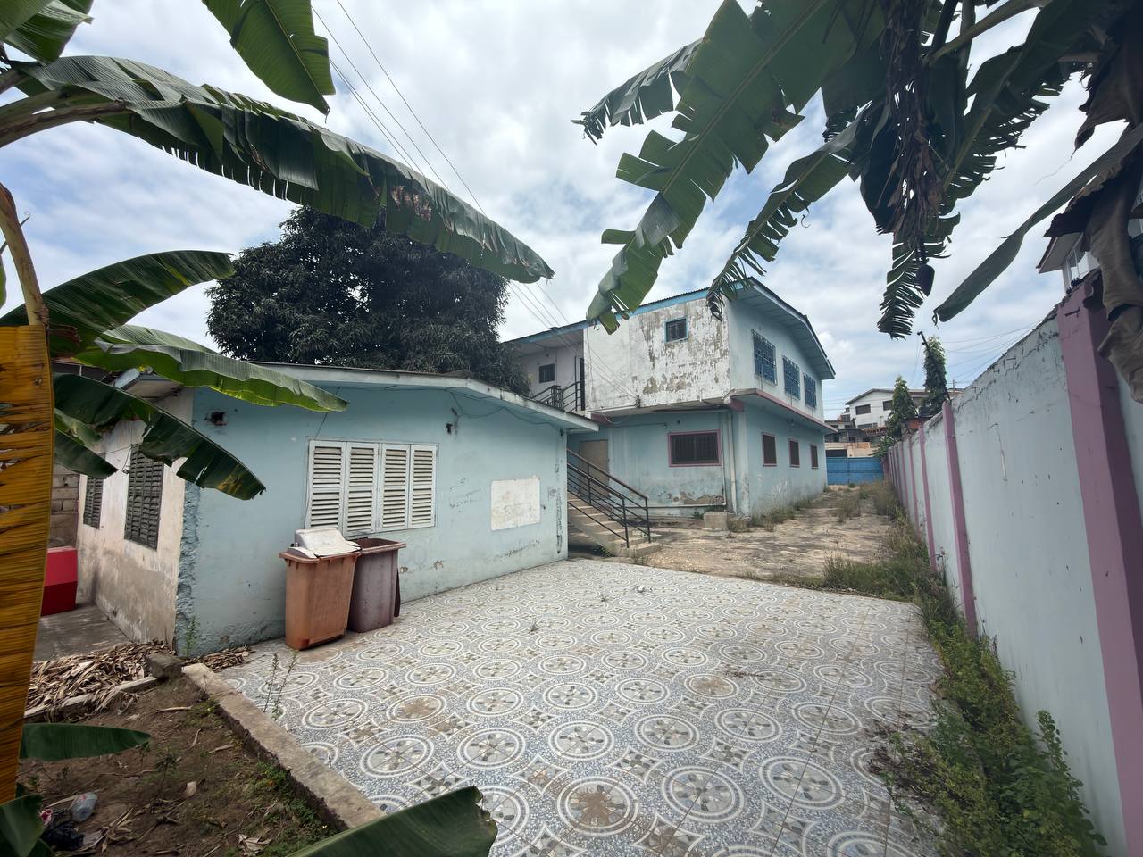 Prime Redevelopment Opportunity in Nima – Land with Existing Building for Sale